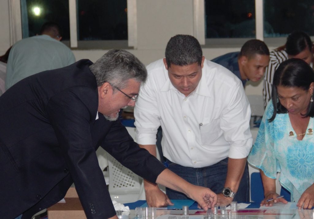 Ryno takes part in an interactive learning activity along with two other teachers.